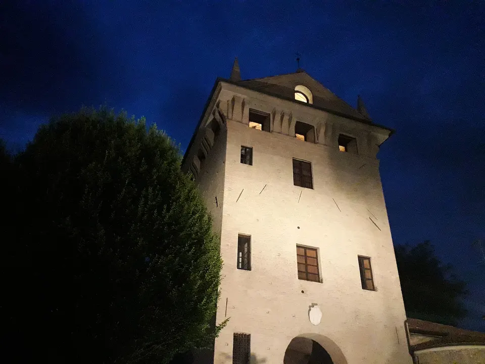 the photo shows the main tower of the former castle of Gonzaga (Mantua) at night